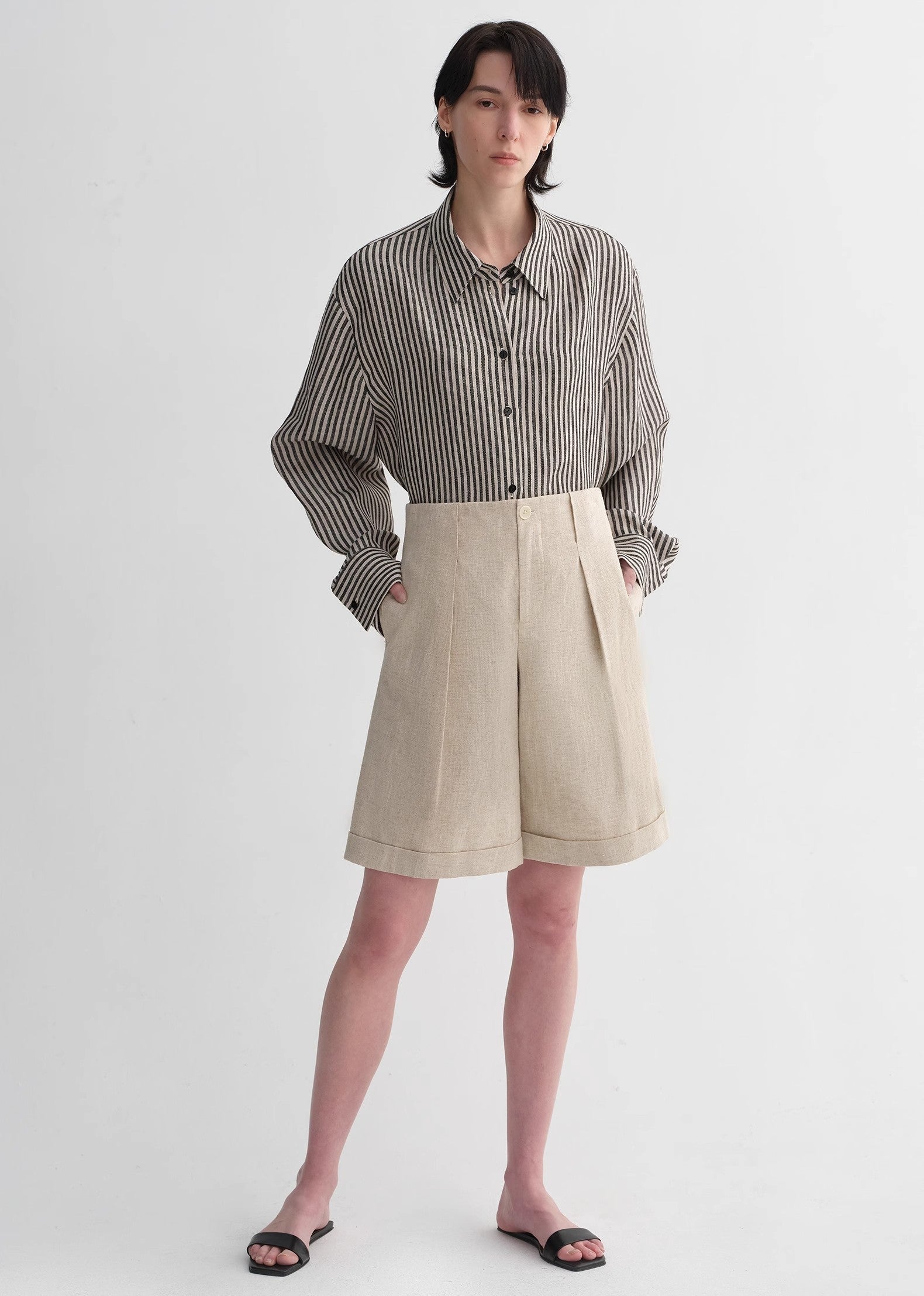 Sophisticated linen waistless pleated wide-leg cropped pants for women, featuring architectural silhouette, textured side pockets-4