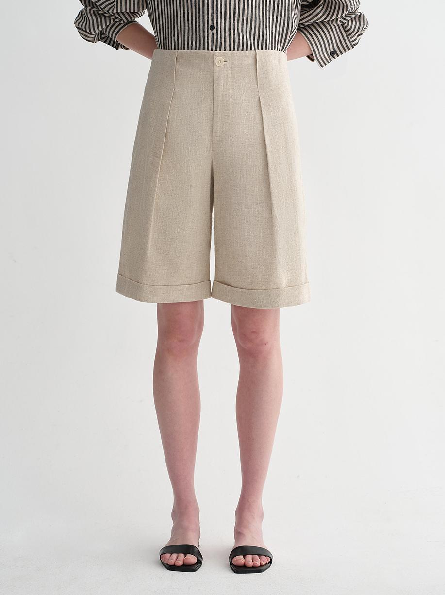 Sophisticated linen waistless pleated wide-leg cropped pants for women, featuring architectural silhouette, textured side pockets-1